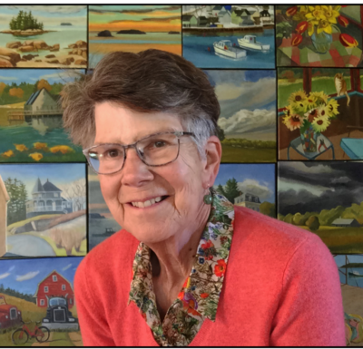 Photo of Leslie Anderson wearing a pink sweater, glasses, and smiling in front of images of her vibrant paintings