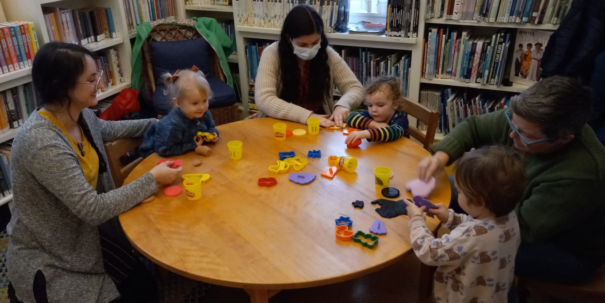 Storytime at the library, children playing with play-doh