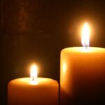 two white candles burning